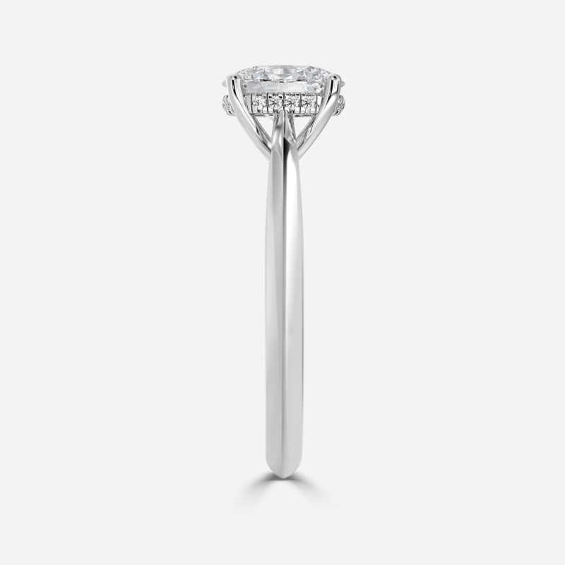 Side View - Classic oval lab grown diamond solitaire ring in plain white gold band.