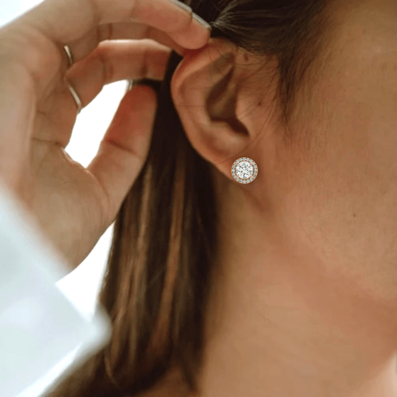 On Model Ear - Brilliant Round Diamond Earrings with Diamond Halo in yellow gold